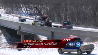 Crews search creek after car found submerged.