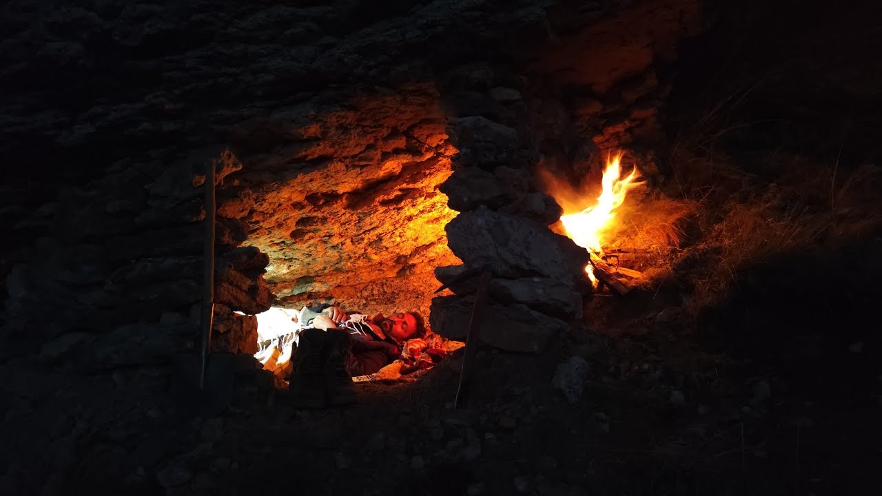 Shelter building. In harsh conditions under rocks, in fossil mountains ...