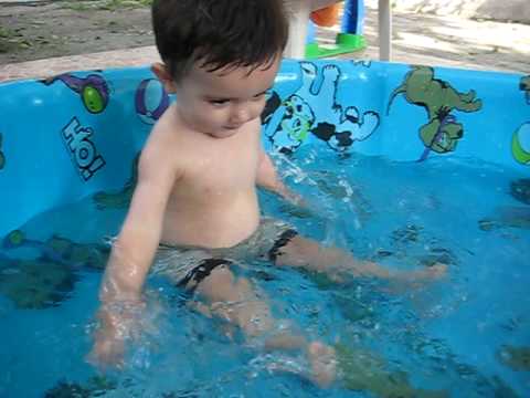 Alex taking a bath on his little pool