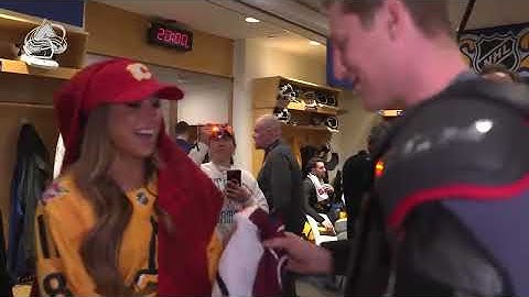 nathan mackinnon gives Tate Mcrae jersey