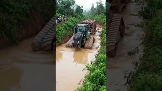 Black New Holland Tractor Battles Deep Mud C T