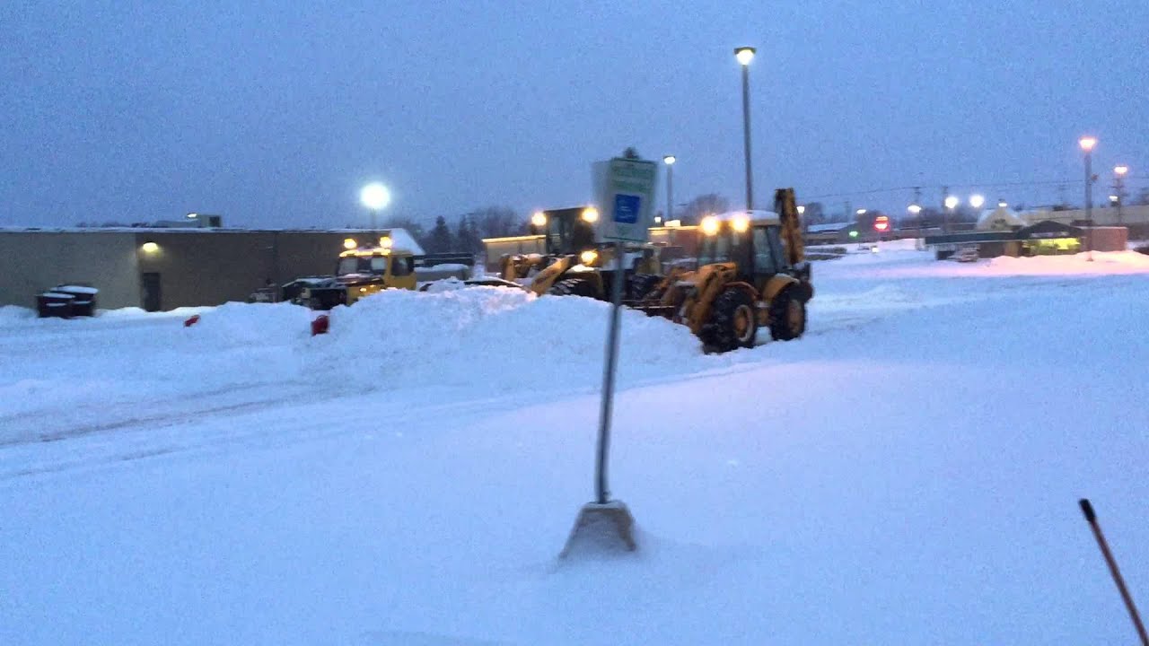 Vandenberg Excavating plowing snow, 21415 with Komatsu 18' , JCB 16