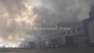 Aftermath as Russian drone attack sparks major warehouse fire in Kyiv district