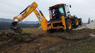 JCB 4cx backhoe loader making a road on a hill