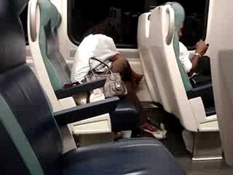 Woman clips toenails on LIRR