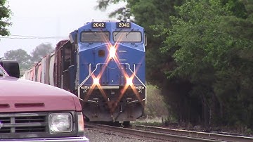 GECX ET44AC leads an NS SD70 Standard Cab and Horn Salute as They Blast through town on NS E49