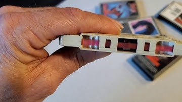 How to: Repair a cassette tape. Gluing the felt tab back on. 80s music rocks