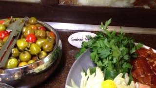 On entering, you are seated at your table. may then go to the salad
bar which has a variety of salads, cheeses and soups (see video).
table, ...