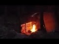 Adjustable lean to tarp shelter for cold weather and Bannock on a stick