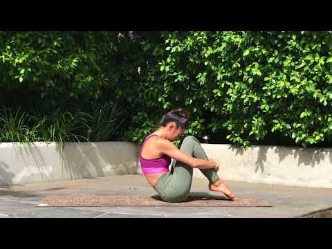 Kick PMS Bloat & Cramps With These 4 Incredibly Soothing Moves Rolling Like A Ball