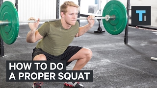 An exercise scientist demonstrates the proper squat