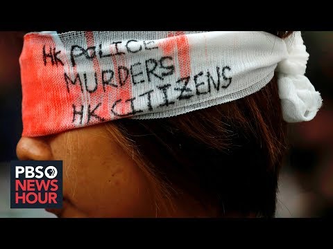 Amid paralyzing Hong Kong demonstrations, China threatens grave consequences