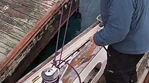 SINGLEHANDED; LEAVING THE DOCK USING THE "MOITESSIER STERN TIE" -- DOCK VIEW