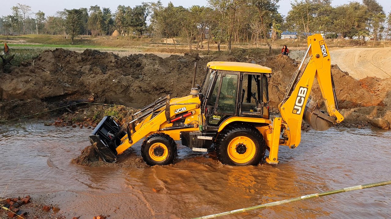 Backhoe Water JCB Machine Blocking Water in Small River and Working For Bridge ...