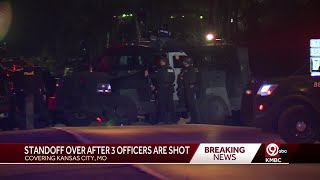 Man found dead, woman in police custody as standoff ends at Kansas City home where 3 officers wer...