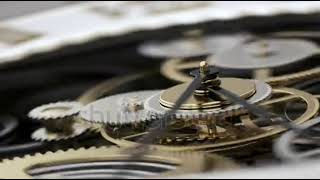 Details Macro Shot Clock Face and Internal Working Mechanism with Rapidly Rotating Arrow and Gears Guide