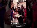 Bride walks down the aisle while singing to groom