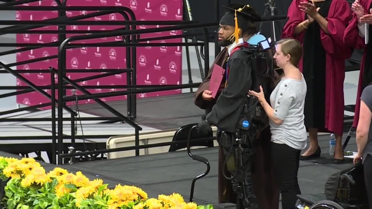 Paralyzed student walks across graduation stage - YouTube