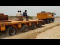 368 ton stator loaded on Goldhofer 16 axle 3 file trailer with custom built Hino