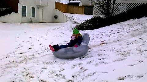 Hadley sledding with pool float 2.13.14