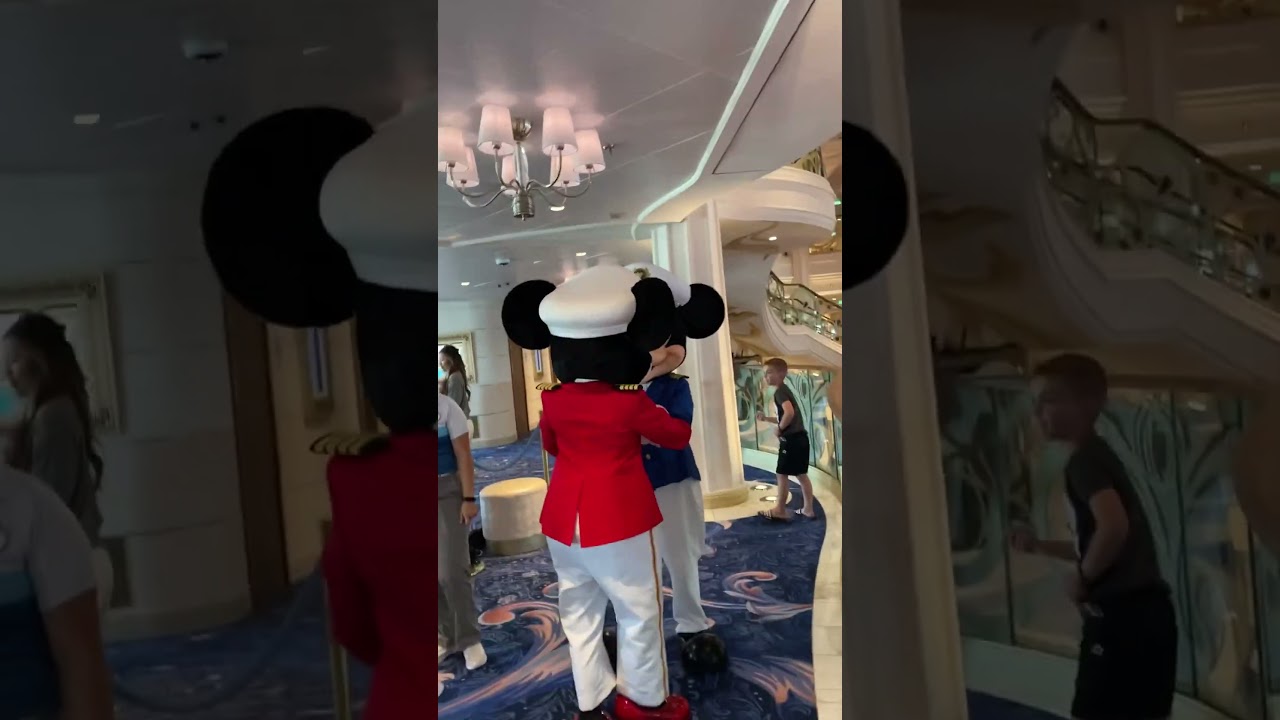 Captain Mickey and Captain Minnie greeting each other 