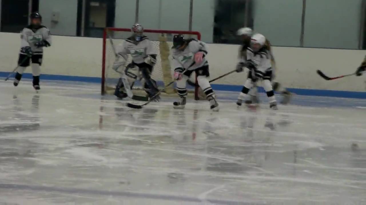 Hamden Girls Hockey players Christine Francasso on the delivery, Rachel Kozak and Collen