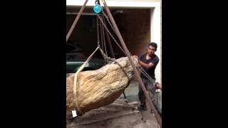 Moving a large boulder without heavy equipment