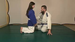 father and daughter training jiu jitsu