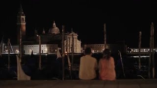 Couple Sitting On The Embankment Stock Video