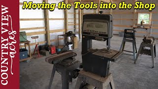 Moving Tools into the Pole Barn.  Gutters and Cupola now on the barn.