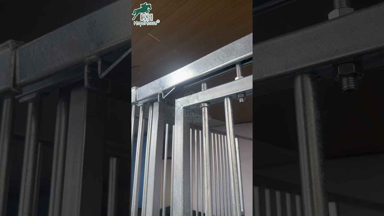 Sliding horse stalls infilled with durable and bright color plastic boards.