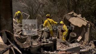 CA:WILDFIRES WORKERS SIFT THROUGH RUBBLE