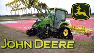 John Deere 4520 with Soucy Tracks Knocking Off Cranberries
