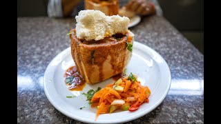 Mom and son catch a bunny chow at Gounden's Umbilo - A true institution of the Durban bunny chow!