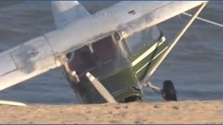 Small plane crash-lands on crowded beach