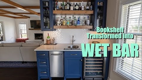 Construction Specialties Transform Bookshelf into Wet Bar in Lawrence Home