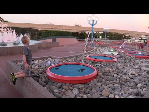 Boy gets a direct hit from the jumping fountains at Epcot