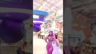 Girl Repeatedly Trips Playing Arcade Punching Game