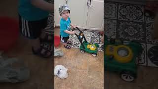 Kids pretend play with lawnmower