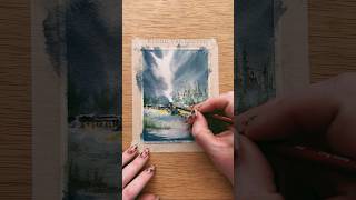 Misty watercolor train traveling through the snow for day 4 of our watercolor holiday card series