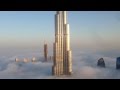 Burj Khalifa and Dubai Downtown are raising from the fog