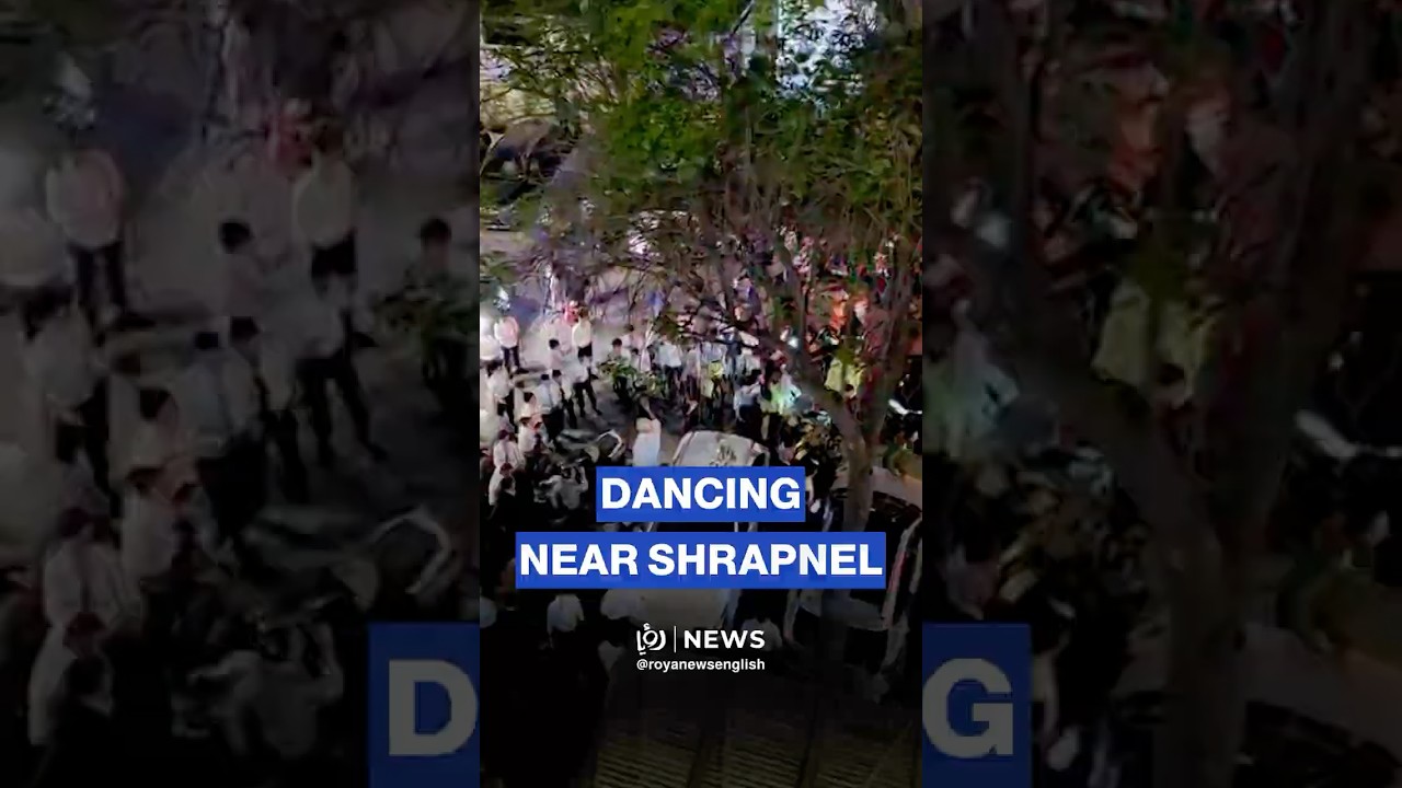 ‘Israeli’ settlers dance near Iranian missile shrapnel in Tel Aviv