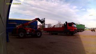 Tractors at work manitou loading big bags
