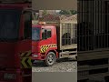 A red circus truck carrying two lions