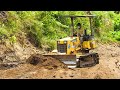 Dozer komatsu d21a pushing and grading dirt full power