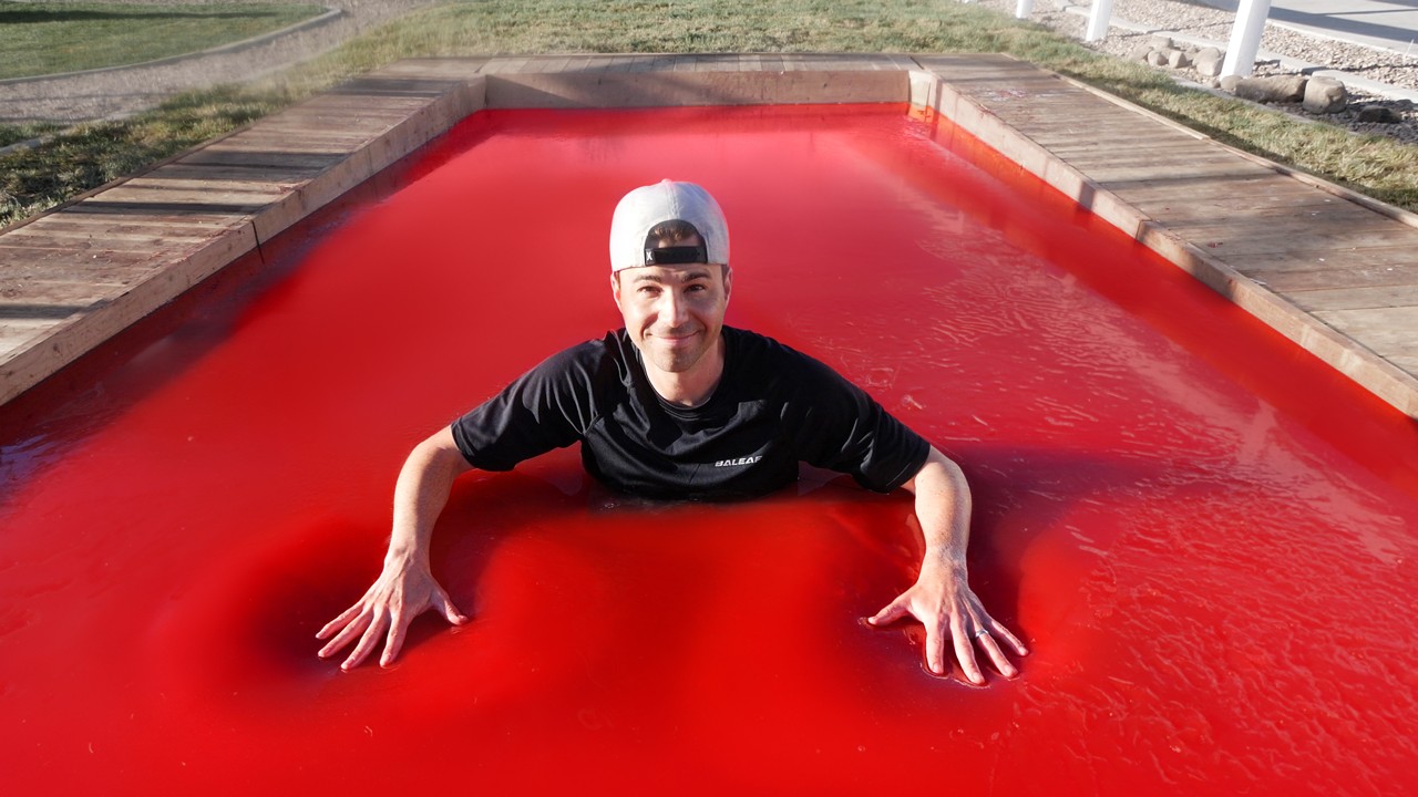 World's LARGEST JELLO POOL- Can you swim in Jello?