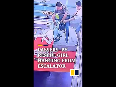 Passers-by rescue girl hanging from escalator in china #shorts