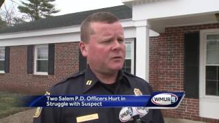Police say 2 officers hurt in struggle with suspect