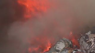 Longview fire crews work into the night putting out scrap metal blaze