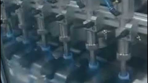 big square bottle filling and capping machine video